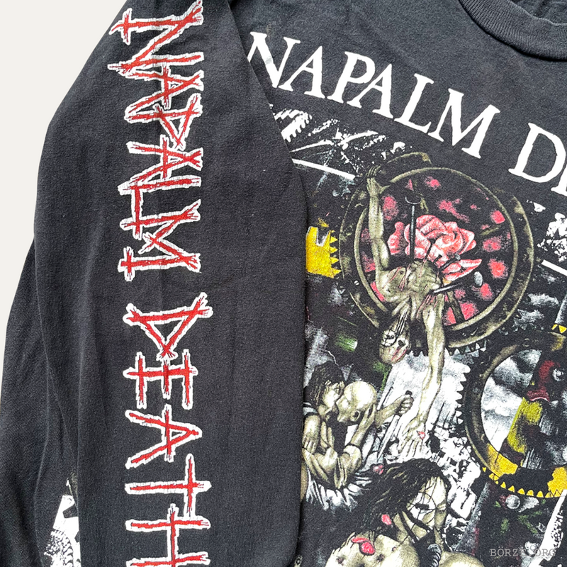 Napalm Death t-shirt with graphic design and text on a plain background