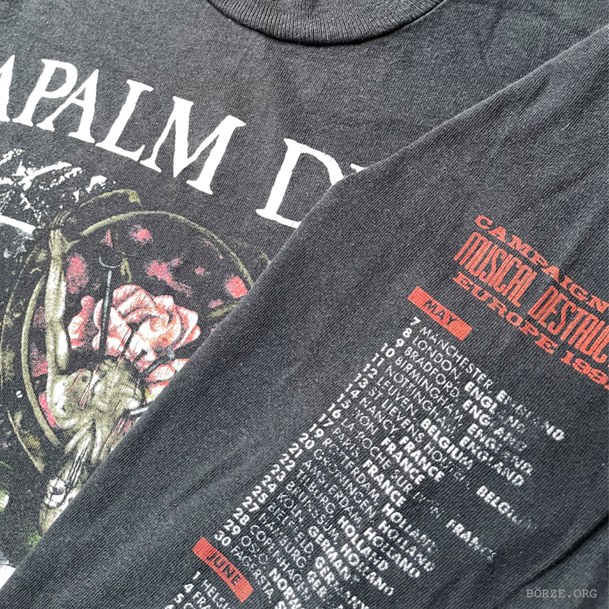 Gray t-shirt with graphic design and text on a dark background