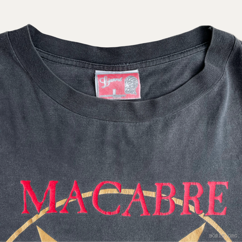 Black t-shirt with 'MACABRE' text and LIZARD neck tag label on a white background
