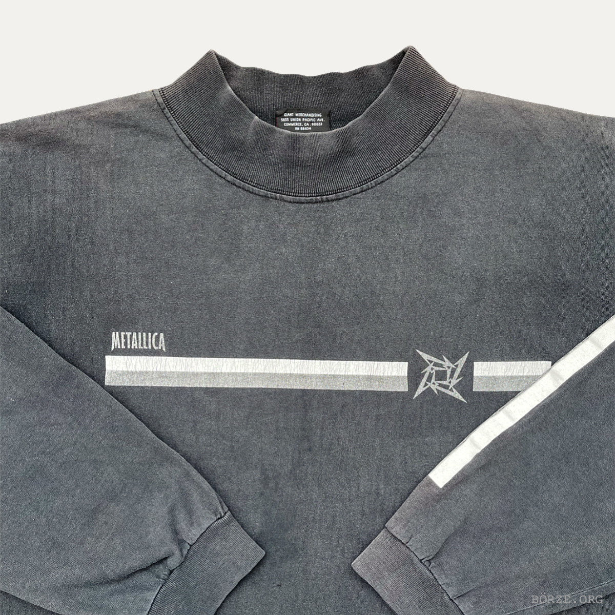 Gray sweatshirt with 'Metallica' logo and design on a white background